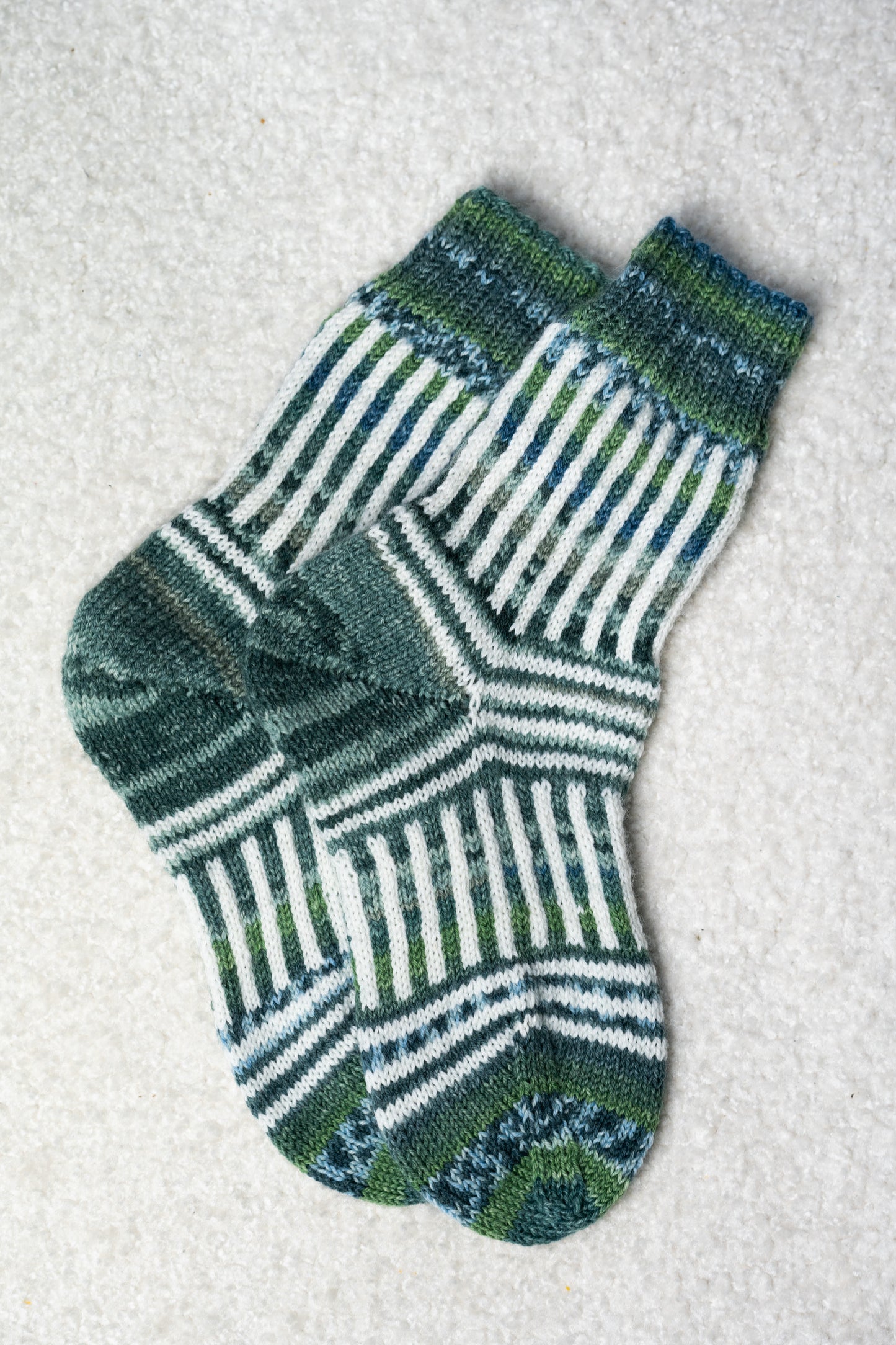 Enschede Socks. A Playful Colorwork Knitting Pattern for Mini Skeins